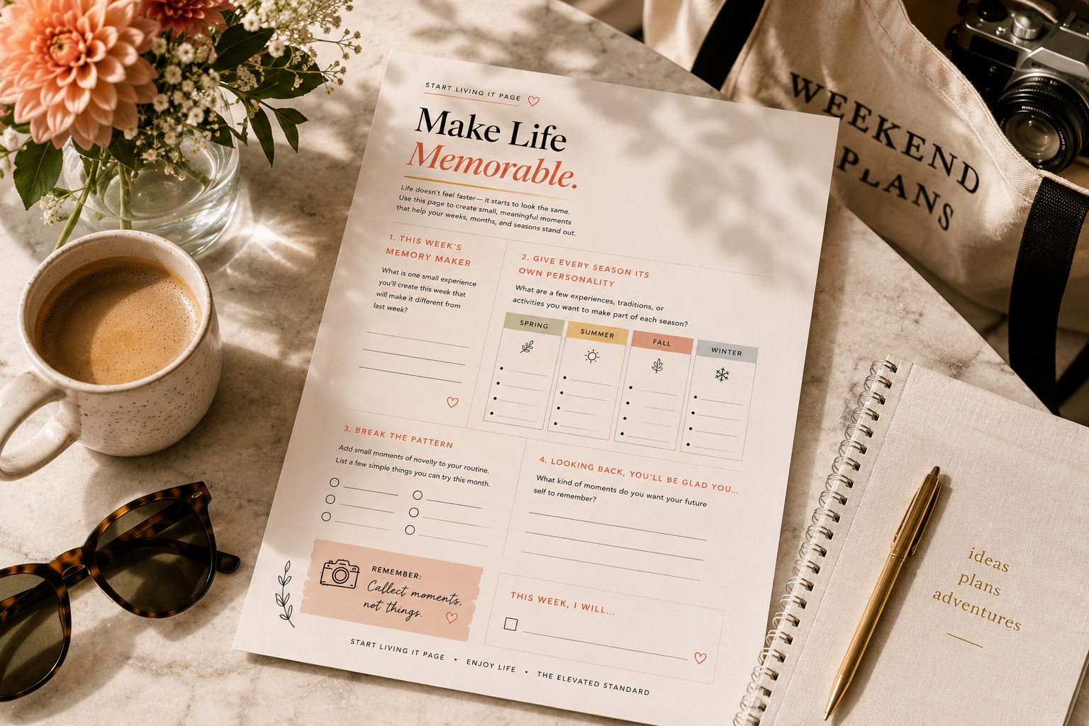 Lifestyle product photo of the Make Life Memorable Start Living It Page on a sunlit marble table beside coffee, flowers, sunglasses, a notebook, and a camera, inspiring intentional living and creating meaningful everyday memories.