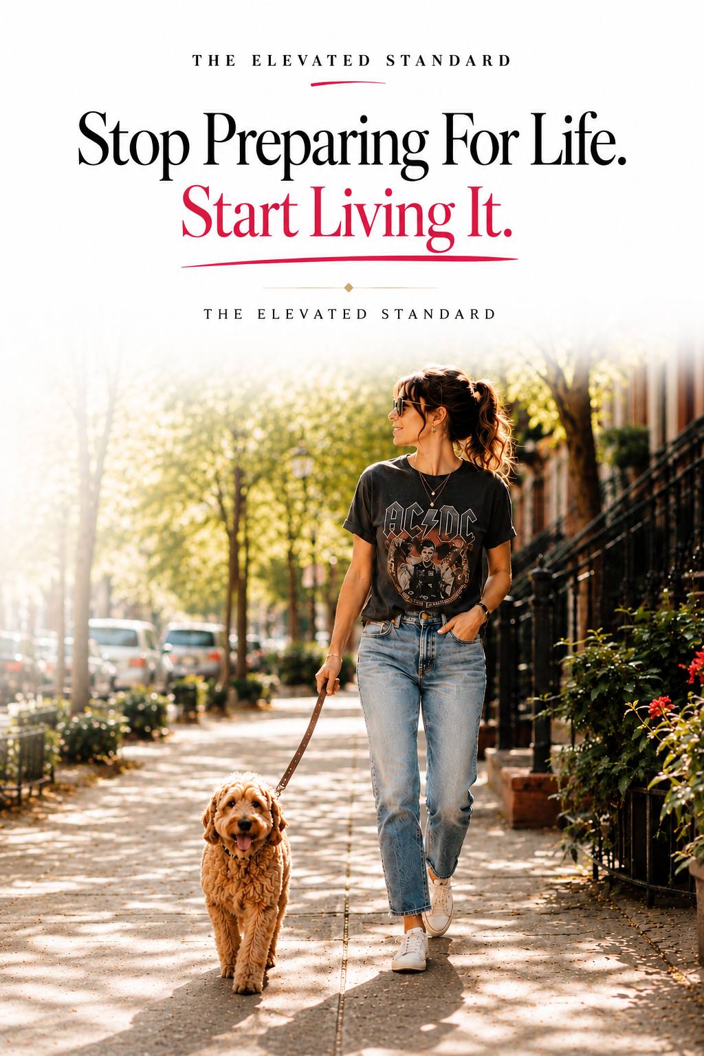 Modern woman wearing a vintage band t-shirt, jeans, sunglasses, and sneakers walking her dog along a sunny tree-lined city street beneath the headline “Stop Preparing For Life. Start Living It.” for The Elevated Standard.
